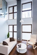 Image of high wall with big windows in modern lounge